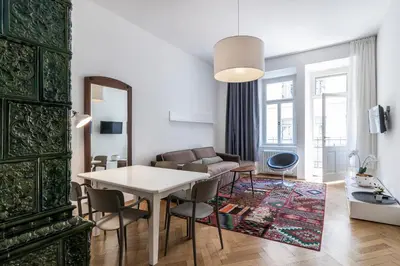 a living room with a table and a couch at Stay COOPER l Laurenz in Bolzano