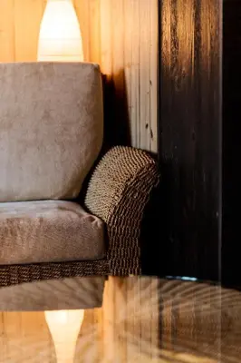 a couch sitting in a room with a glass table at Ciasa Buro - Resh in Moena