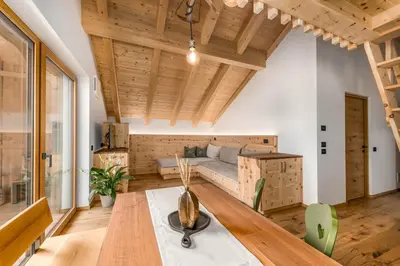 a living room with a couch and a table at La Munt in Longega