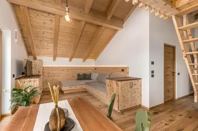 a room with a bed and a table at La Munt in Longega