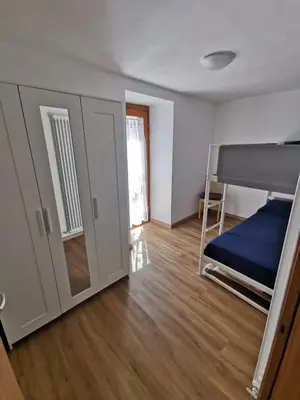 a room with a bunk bed and a bunk bed at Casa Dolomiti in Mezzano