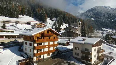 an aerial view of a building in the snow at Majon Di Roces in Canazei