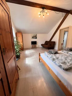 a bedroom with two beds in a attic at Haus Tauber in Cornaiano
