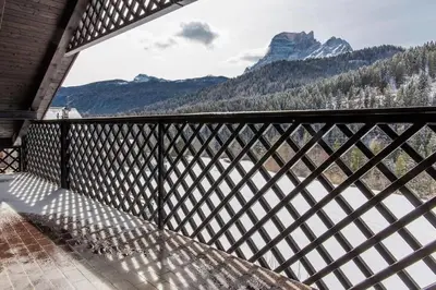 a balcony with a view of the mountains at Appartamento Duplex San Vito di Cadore in San Vito di Cadore