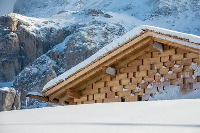 a building with snow on top of a mountain at Zallinger Dolomites in Seiser Alm