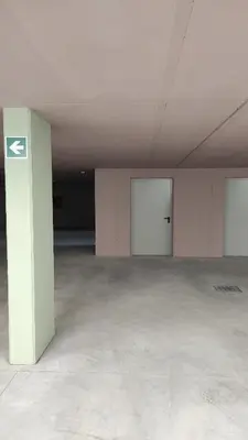 an empty room with two doors in a building at Nido City Studio in Brixen
