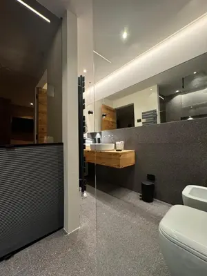 a bathroom with a toilet and a sink at Lisa Da Pent in Canazei