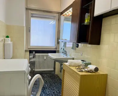 a small bathroom with a sink and a sink at Casa ai Dossi in Bellamonte