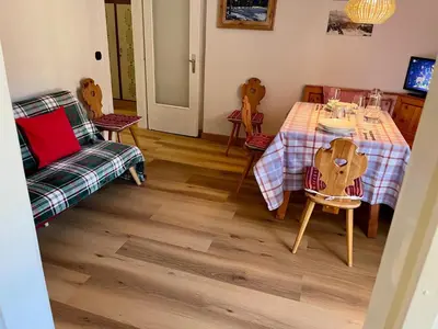 a dining room with a table and chairs at Casa ai Dossi in Bellamonte