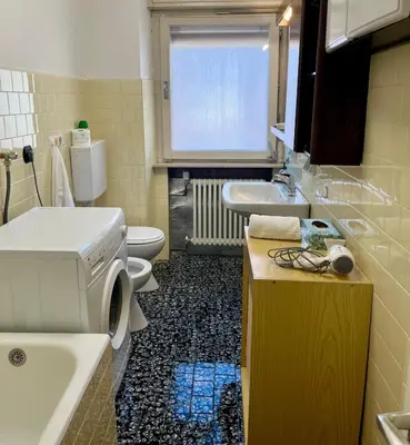 a bathroom with a sink and a toilet and a sink at Casa ai Dossi in Bellamonte