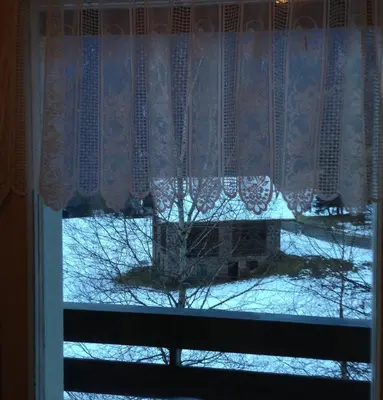 a window with a view of a snow covered yard at Casa ai Dossi in Bellamonte
