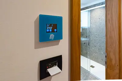 a blue box on a wall next to a door at mySHH in Vigo di Fassa