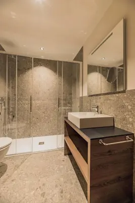 a bathroom with a sink and a shower at mySHH in Vigo di Fassa