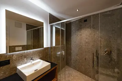 a bathroom with a sink and a shower at mySHH in Vigo di Fassa