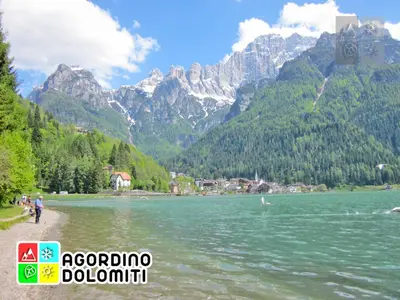a view of a lake with mountains in the background at Dolomiti Sot i piz in Piaia