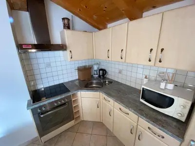 a small kitchen with a sink and a microwave at Lexhof in Mareta