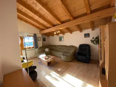 a living room with a couch and a table at Lexhof in Mareta