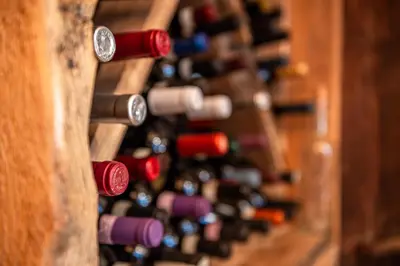 a bar with a wooden wall with the words osteroco at Villa Ruggero Wine Hotel in Campitello di Fassa
