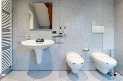 a bathroom with a toilet and a sink at Artist House in Merano