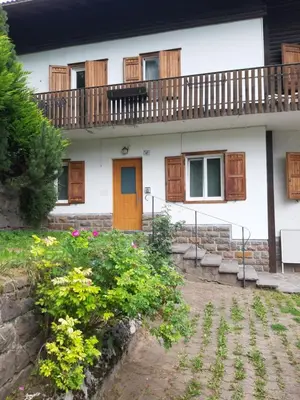 a house with a balcony on top of it at Roda de Vael in Moena