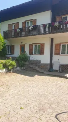 a house with a balcony on top of it at Roda de Vael in Moena