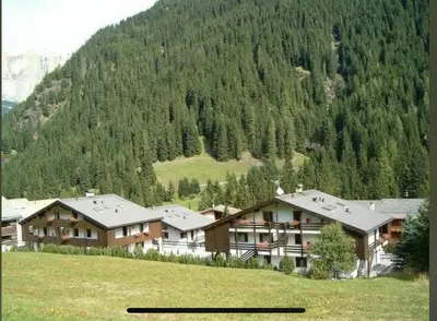 a large house in the middle of a mountain at Casa Canazei, 2-5 pers Appartement 122 in Canazei