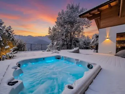a hot tub on a deck with a view of the mountains at Chalet Astra, Whirlpool & Sauna in San Pancrazio dʼUltimo