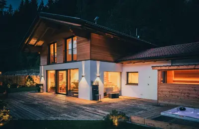 a shower in a bathroom with a shower head at Chalet Astra, Whirlpool & Sauna in San Pancrazio dʼUltimo