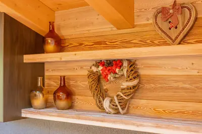 a bedroom with a bed with towels on it at The Dreaming Home Dolomiti in Canale dʼAgordo