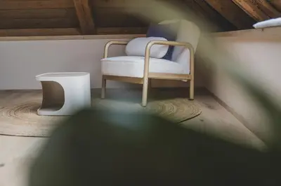 a small room with a chair and a table at O'Mama family time - am Eggerhof in Mühlbach
