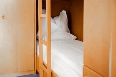 a couple of bunk beds in a room at Hotel Euròpa Dolomites in Selva di Val Gardena