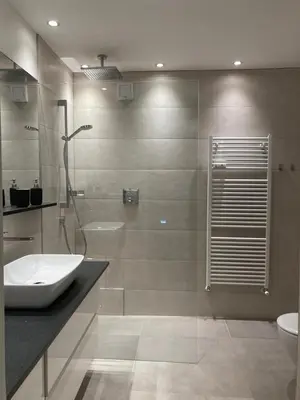 a bathroom with a sink and a shower and a toilet at Apartment Larissa in Merano