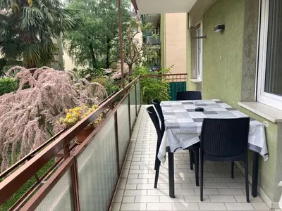 a balcony with a table and chairs on a balcony at Apartment Larissa in Merano
