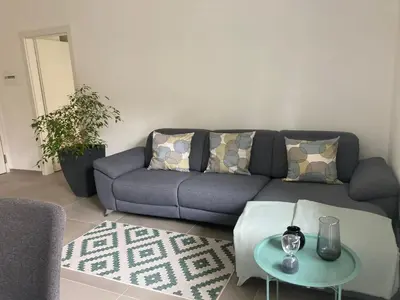 a living room with a couch and a table at Apartment Larissa in Merano