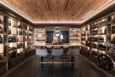 a wine tasting room with a table and chairs at Lifestyle Hotel Alpin in Schenna