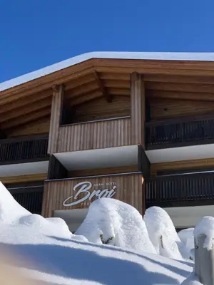 a building covered in snow in front at Hotel Garni Broi - Charme & Relax in Selva di Val Gardena