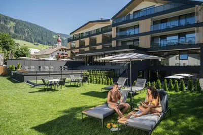 a building with snow in front of it at Montanaris Alpine - Active - Relax in Villabassa