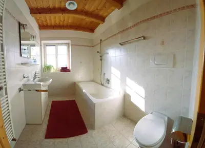 a bathroom with a tub and a toilet and a sink at Villa Andre in Tires