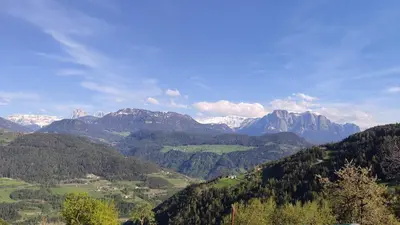 a view of a mountain range with snow covered mountains at Mitterhofer in Villandro