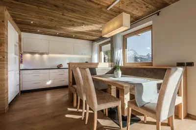 a bedroom with a bed and a window at Appartements Chalet Bandiarac in San Cassiano