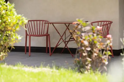 two chairs and a table in a patio at Pramian1394 in Cermes