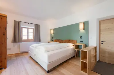 a large white bed in a room with a window at Pramian1394 in Cermes