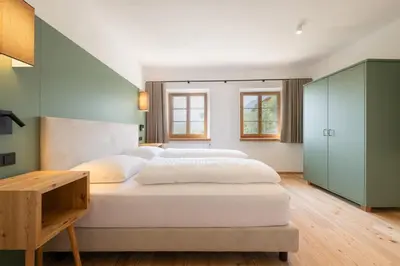 a bedroom with two beds and a table at Pramian1394 in Cermes