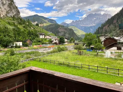 a view from the balcony of a village in the mountains at Casa di Charme sul Civetta Dolomiti in Caprile