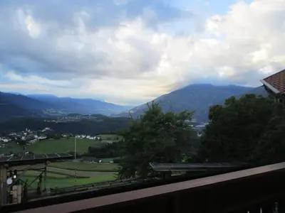 a view of a green field and mountains at CHALET LEE's HERZNESCHTL in Rodengo