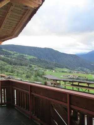 a balcony with a view of a mountain at CHALET LEE's HERZNESCHTL in Rodengo