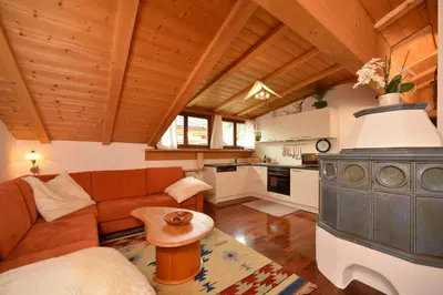 a living room with a couch and a table at Apartments Rezia in Ortisei