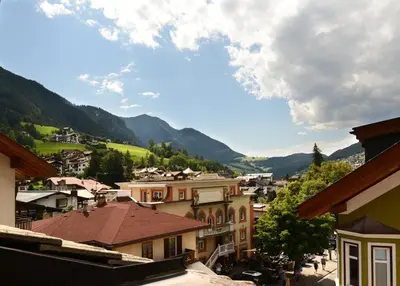 a view of a town with mountains in the background at Apartments Rezia in Ortisei