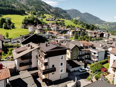 an aerial view of a town in the mountains at Apartments Rezia in Ortisei