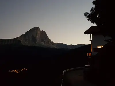 a view of a mountain at sunset from a house at Lüch da Börz in Antermoia